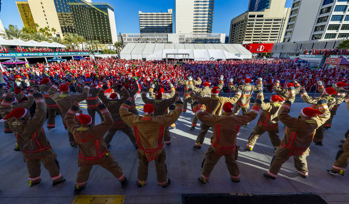 Members of the Clark County Fire Department with the 24-2 cadre conduct stretching exercises wi ...