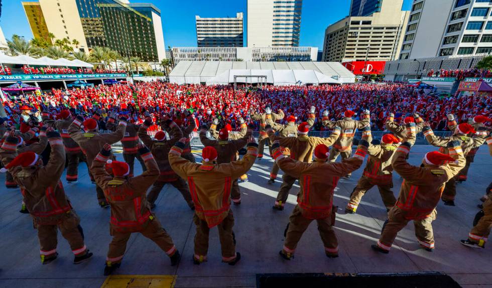 Members of the Clark County Fire Department with the 24-2 cadre conduct stretching exercises wi ...