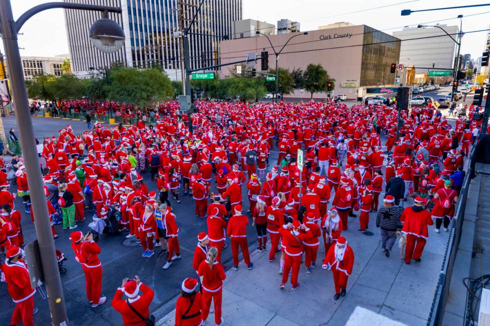 Entrants gather about E. Bridger Avenue and the start line for the Las Vegas Great Santa Run th ...