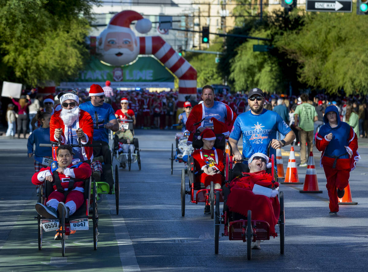 Some of the first entrants make their way along E. Bridger Avenue from the starting line for th ...