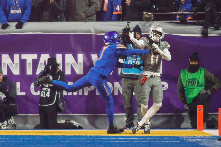 Boise State cornerback A'Marion McCoy (7) knocks the ball away from UNLV wide receiver Ricky Wh ...