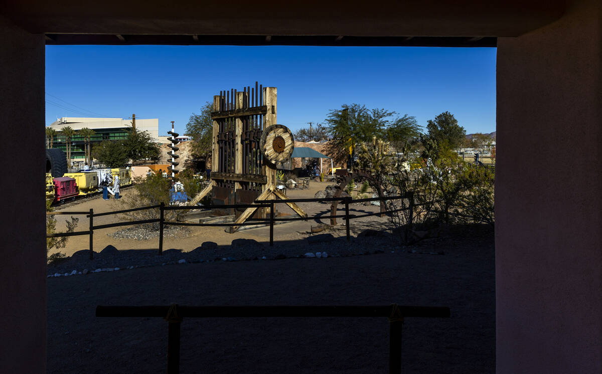 A former stamp mill is on display along with other equipment within The Mine Experience at the ...