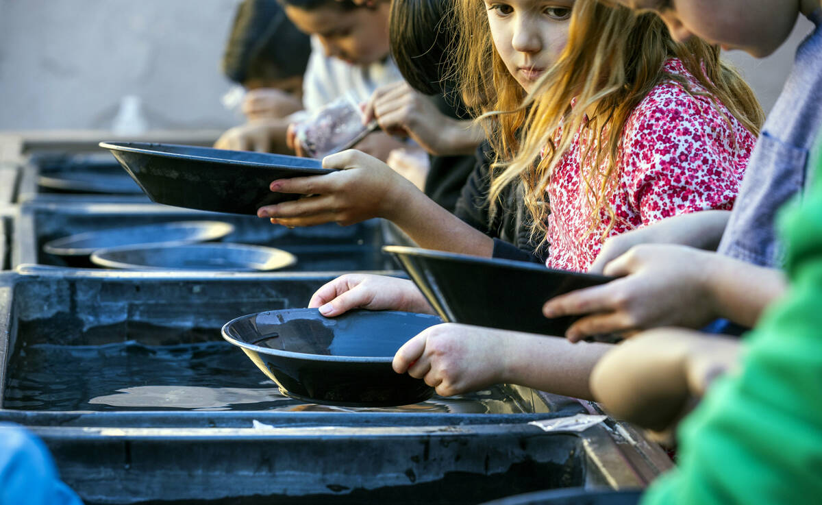 Kids learn the art of panning in a class at The Mine Experience within the Gordon McCaw STEAM A ...