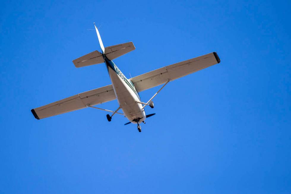 A plane successfully takes flight after it emergency landed on Kyle Canyon Road, Saturday, Dec. ...