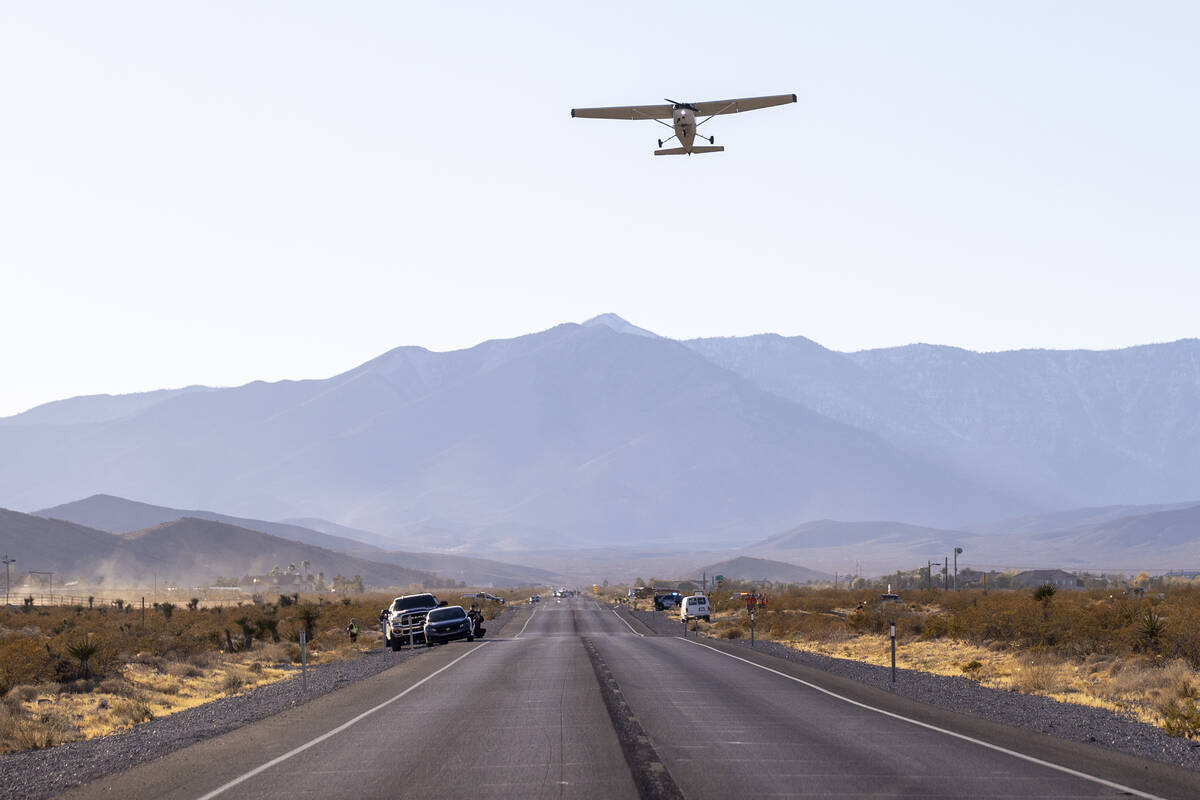 A plane successfully takes flight after it emergency landed on Kyle Canyon Road, Saturday, Dec. ...