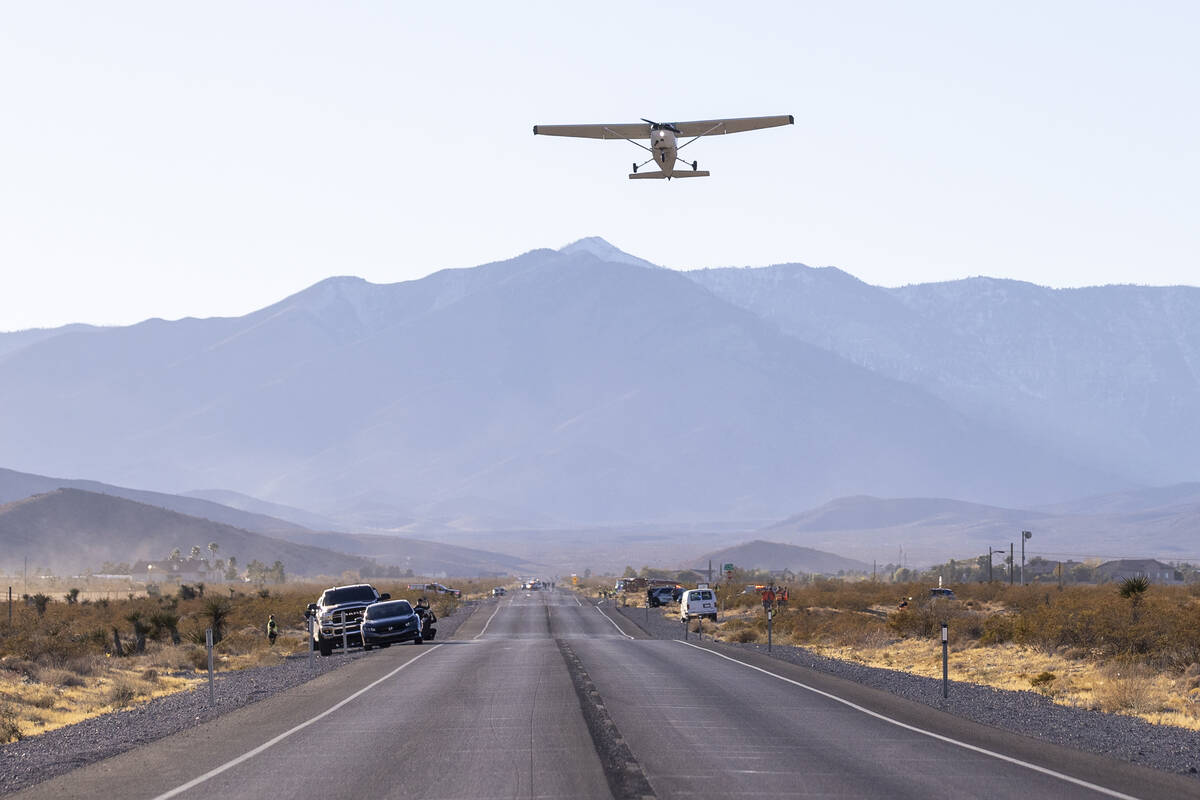 A plane successfully takes flight after it emergency landed on Kyle Canyon Road, Saturday, Dec. ...