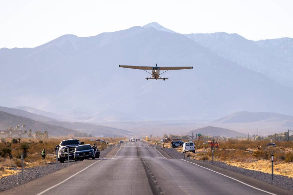 A plane successfully takes flight after it emergency landed on Kyle Canyon Road, Saturday, Dec. ...