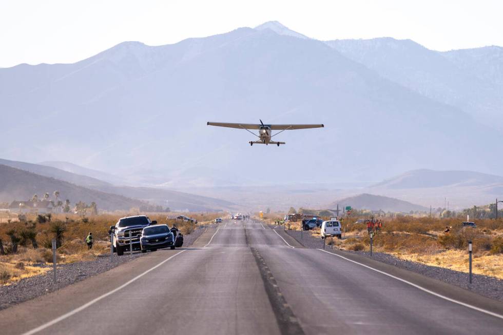 A plane successfully takes flight after it emergency landed on Kyle Canyon Road, Saturday, Dec. ...