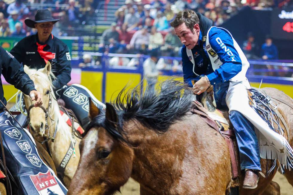 Bareback rider Cole Franks completes his ride during round three of the National Finals Rodeo a ...