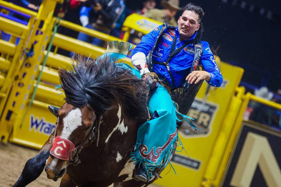 Bareback rider Jesse Pope completes his ride during round three of the National Finals Rodeo at ...