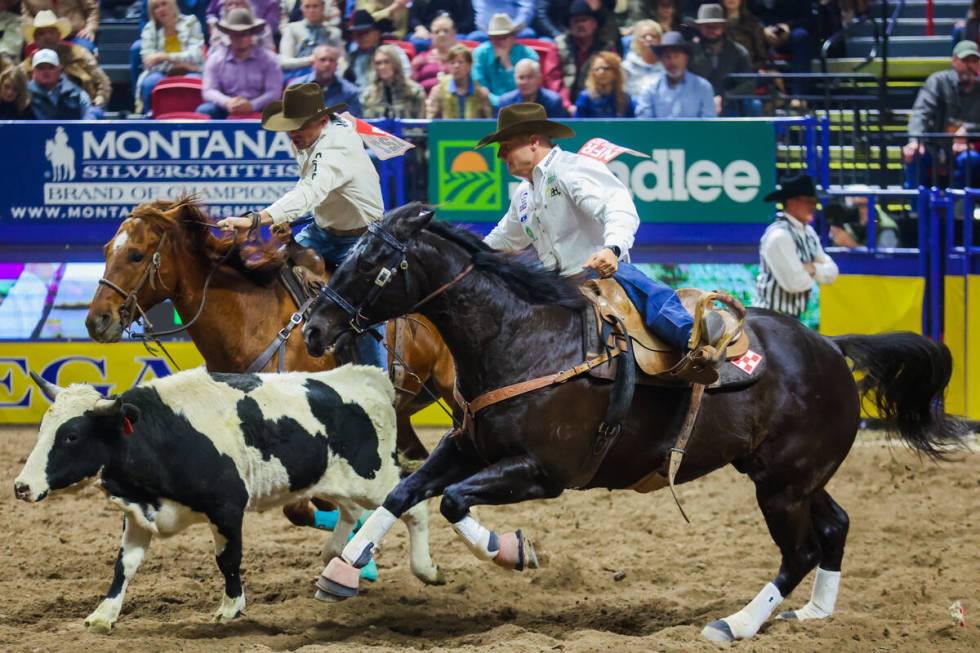 Steer wrestler J.D. Struxness rides out to chase the steer during round three of the National F ...