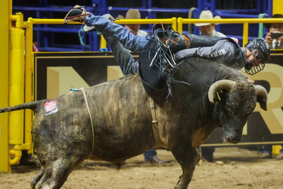 Bull rider T.J. Gray rides Dan O during round three of the National Finals Rodeo at the Thomas ...