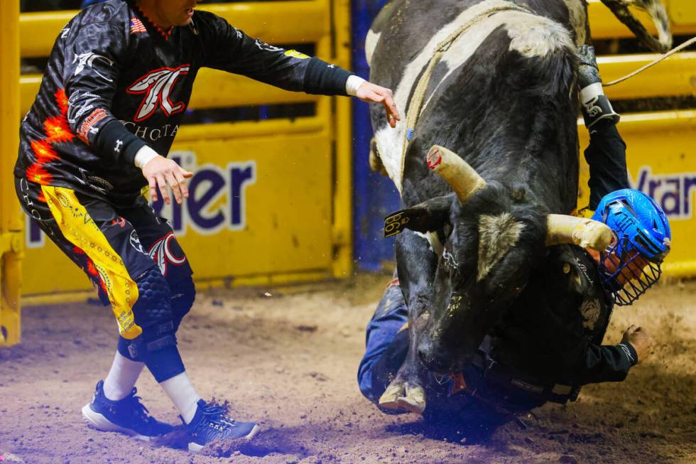 Bull rifer Dustin Boquet falls under Hell Yeah Roscoe during round four of the National Finals ...