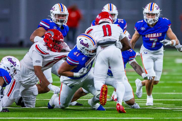 Arbor View running back Kamareion Bell (0) is stopped by Bishop Gorman defensive lineman Prince ...