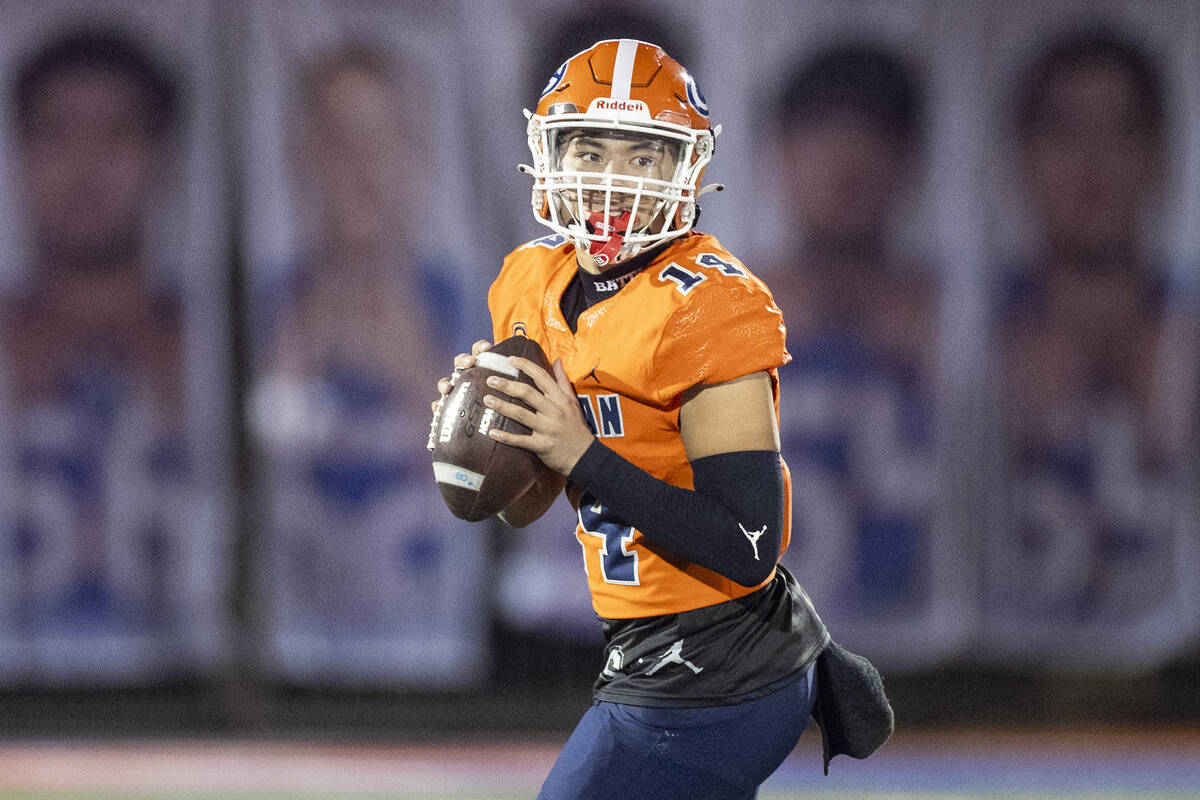 Bishop Gorman quarterback Maika Eugenio (14) looks to throw the ball during the Class 5A Divisi ...