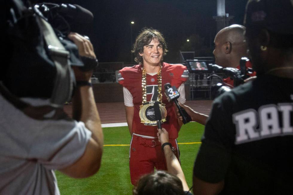 Arbor View quarterback Thaddeus Thatcher (7) is awarded the Raiders High School Showcase Most O ...