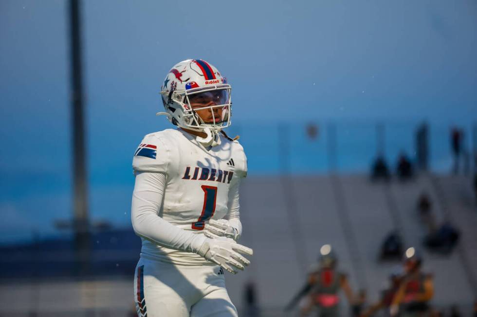 Liberty Running Back Ezra Sanelivi (1) jogs to the sideline after a Liberty turnover during a f ...