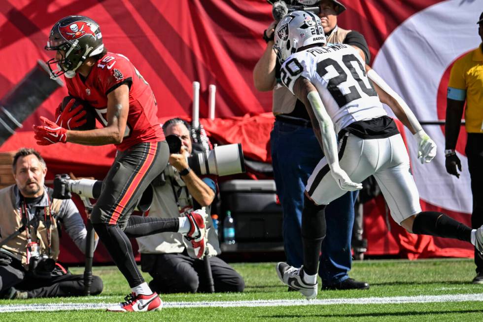 Tampa Bay Buccaneers wide receiver Jalen McMillan (15) scores a touchdown against Las Vegas Rai ...