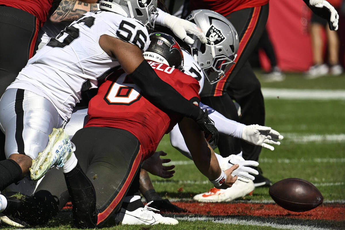 Tampa Bay Buccaneers quarterback Baker Mayfield (6) fumbles the ball and Las Vegas Raiders safe ...