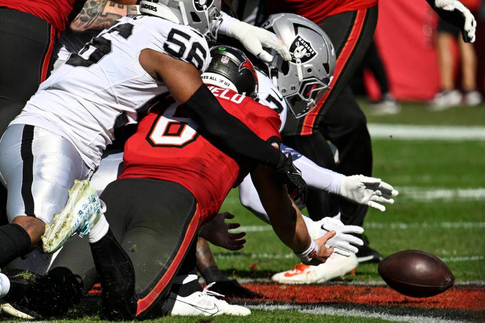 Tampa Bay Buccaneers quarterback Baker Mayfield (6) fumbles the ball and Las Vegas Raiders safe ...