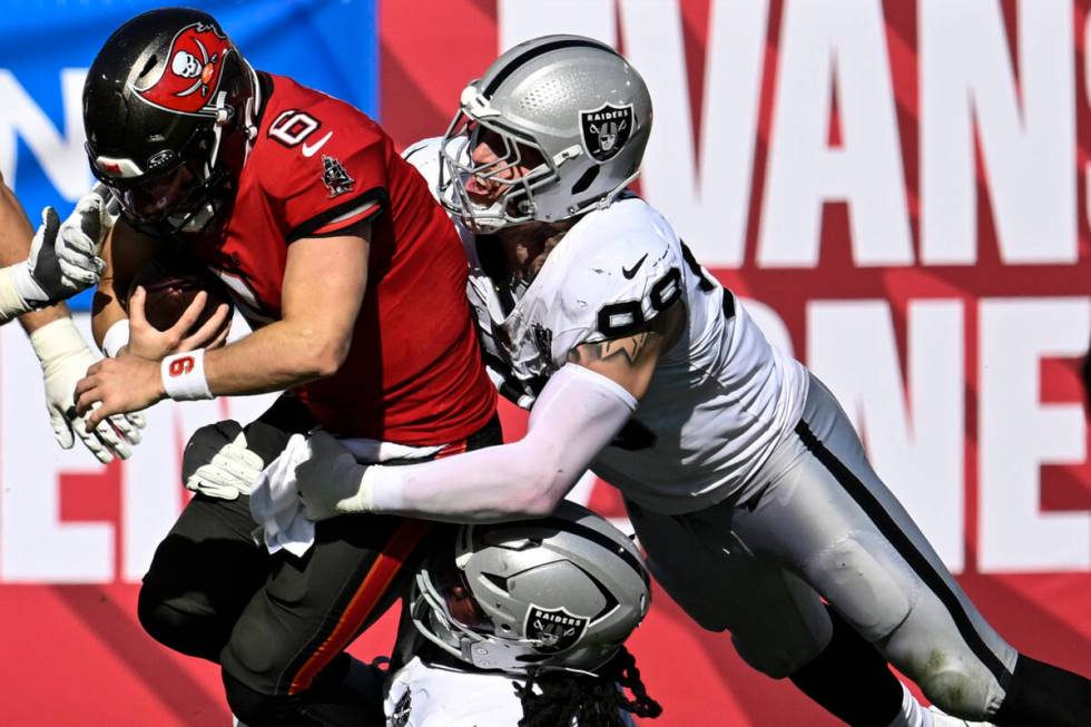 Tampa Bay Buccaneers quarterback Baker Mayfield (6) is sacked by Las Vegas Raiders defensive ta ...