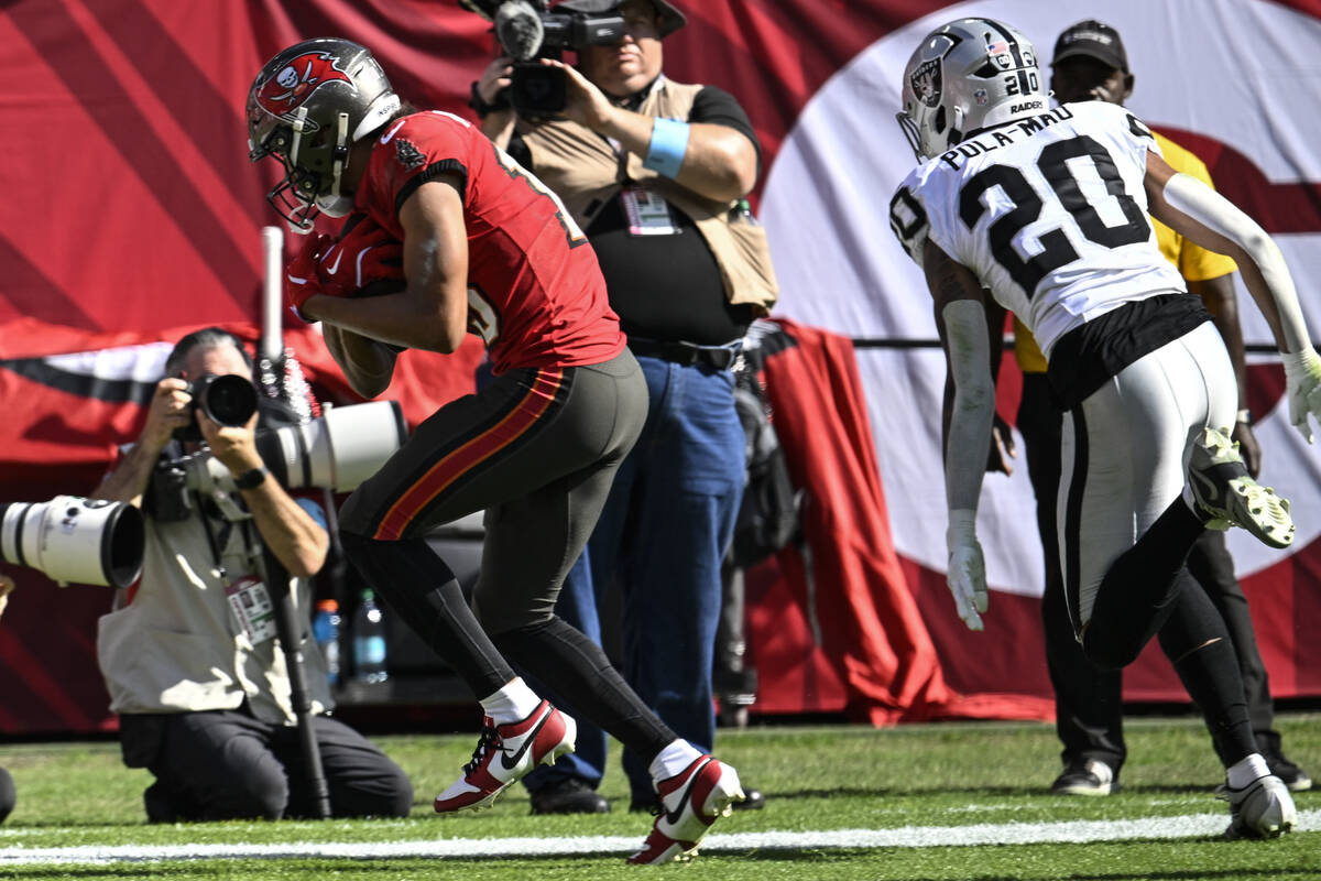 Tampa Bay Buccaneers wide receiver Jalen McMillan (15) scores a touchdown against Las Vegas Rai ...