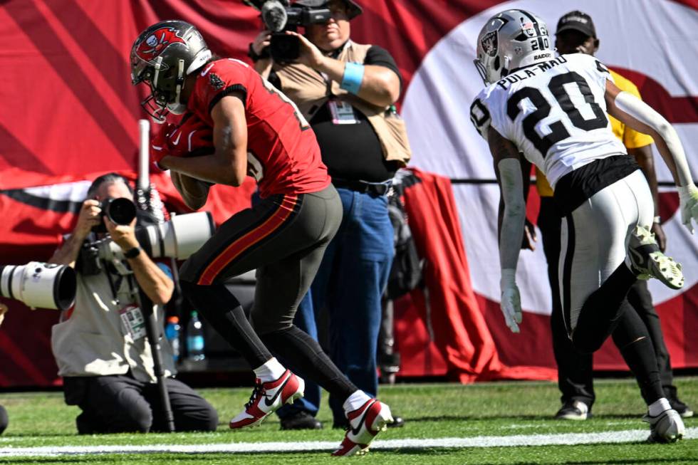 Tampa Bay Buccaneers wide receiver Jalen McMillan (15) scores a touchdown against Las Vegas Rai ...