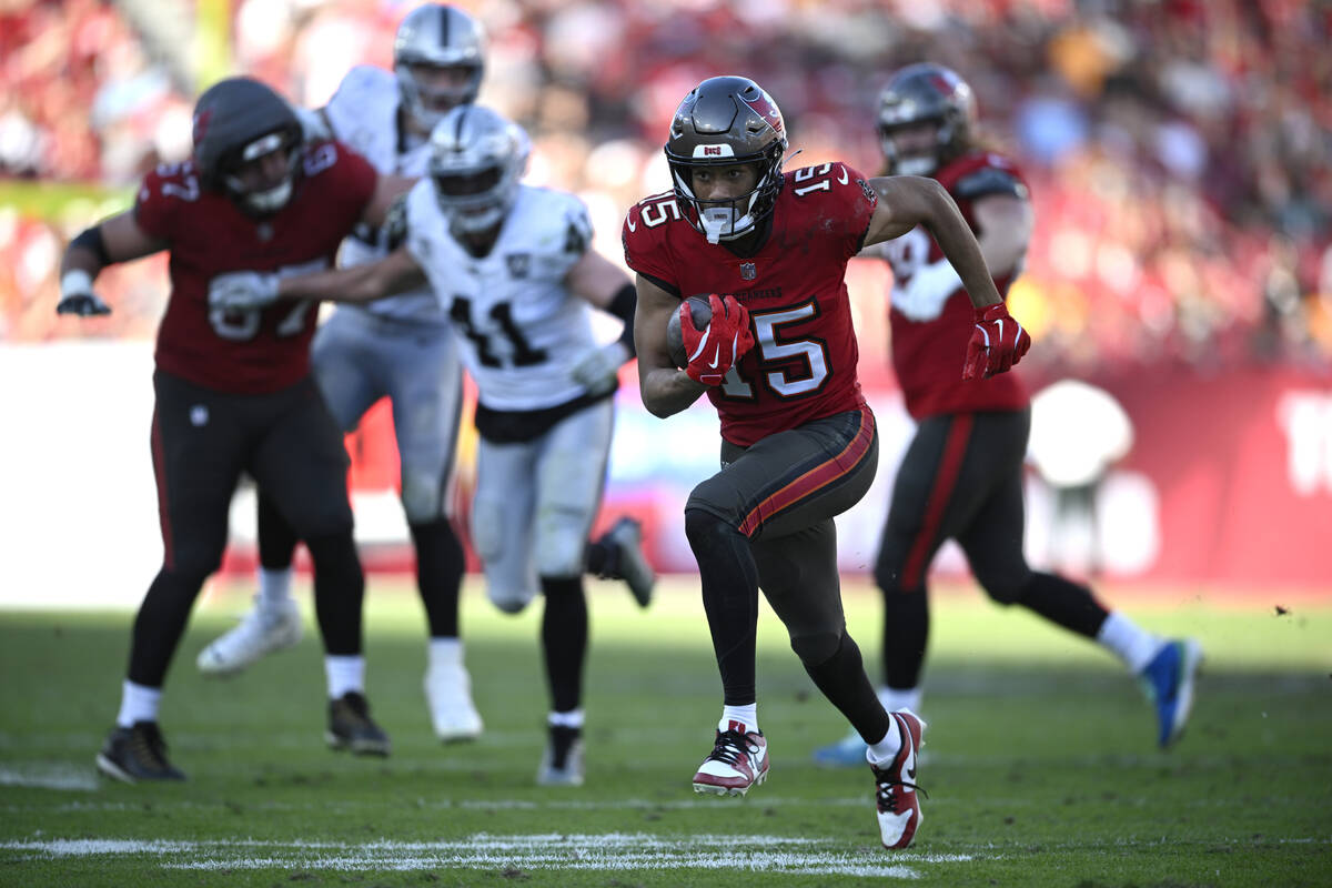 Tampa Bay Buccaneers wide receiver Jalen McMillan (15) scores a touchdown on a 29-yard pass pla ...