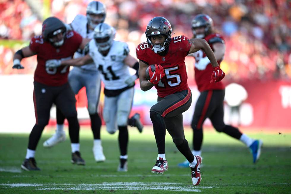 Tampa Bay Buccaneers wide receiver Jalen McMillan (15) scores a touchdown on a 29-yard pass pla ...