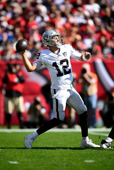 Las Vegas Raiders quarterback Aidan O'Connell (12) throws a pass against the Tampa Bay Buccanee ...