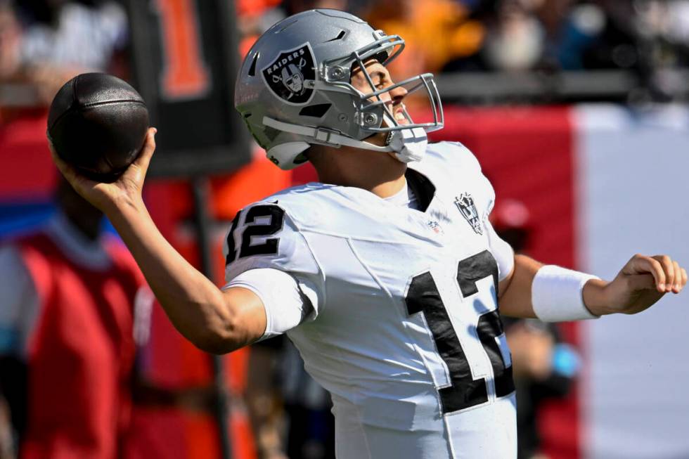 Las Vegas Raiders quarterback Aidan O'Connell (12) passes the ball against the Tampa Bay Buccan ...