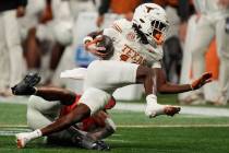 Texas wide receiver Silas Bolden (11) runs against Georgia linebacker Jalon Walker (11) during ...