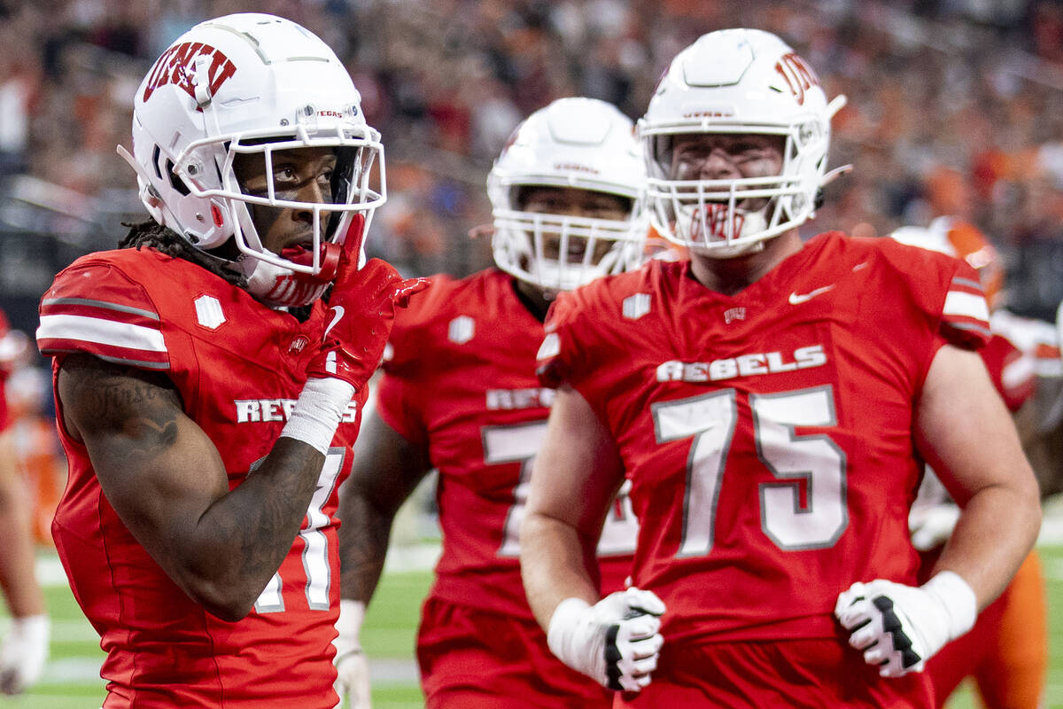 UNLV wide receiver Ricky White III (11) celebrates after scoring a touchdown during the college ...