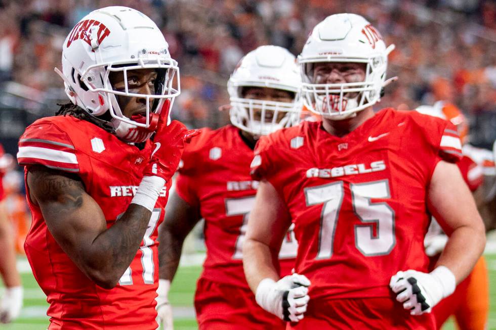 UNLV wide receiver Ricky White III (11) celebrates after scoring a touchdown during the college ...