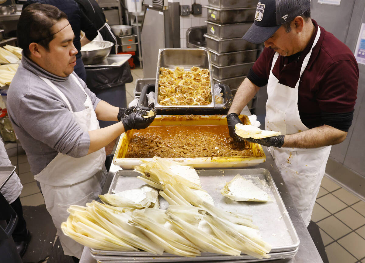 Jesus Castillo, left, and Jose Gentil make tamales at Doña Maria's Tamales, on Thursday, Dec. ...