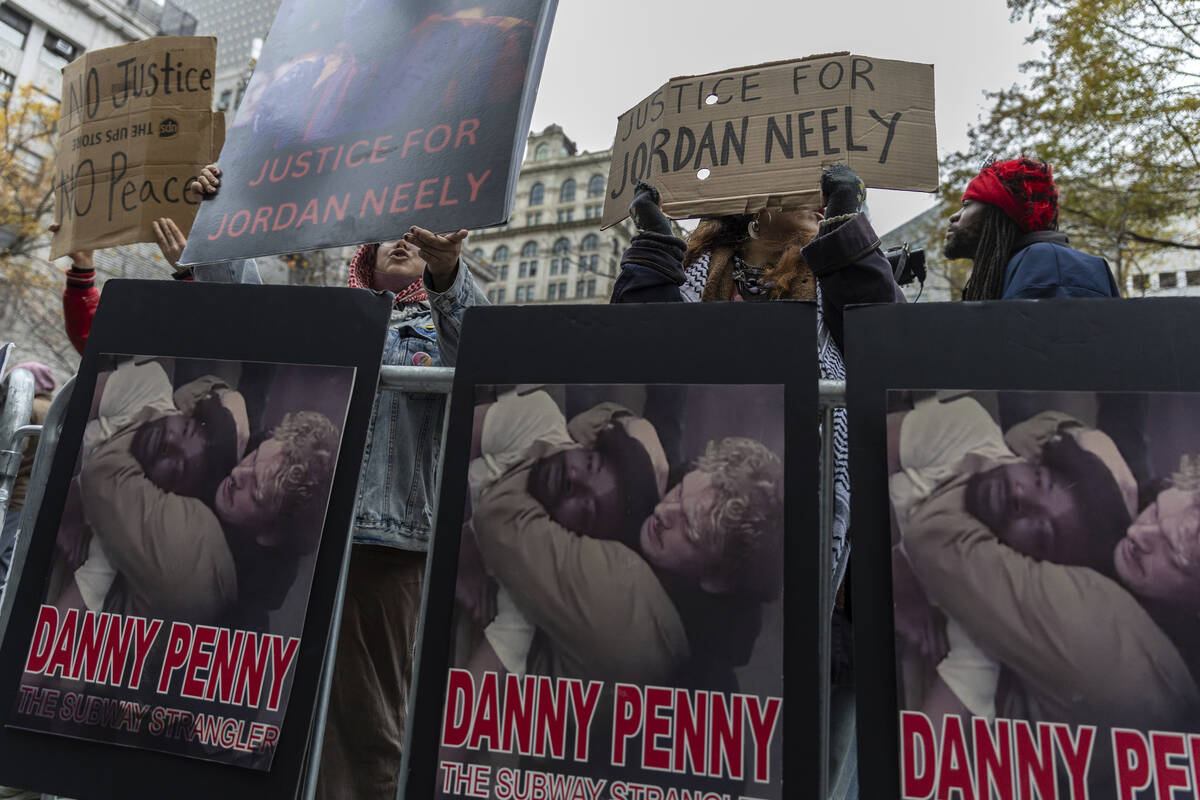 People protest the not guilty verdict of Daniel Penny outside the criminal court, Monday, Dec. ...