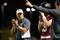 Faith Lutheran High head coach Mike Sanford reacts to a play from the sidelines during the firs ...