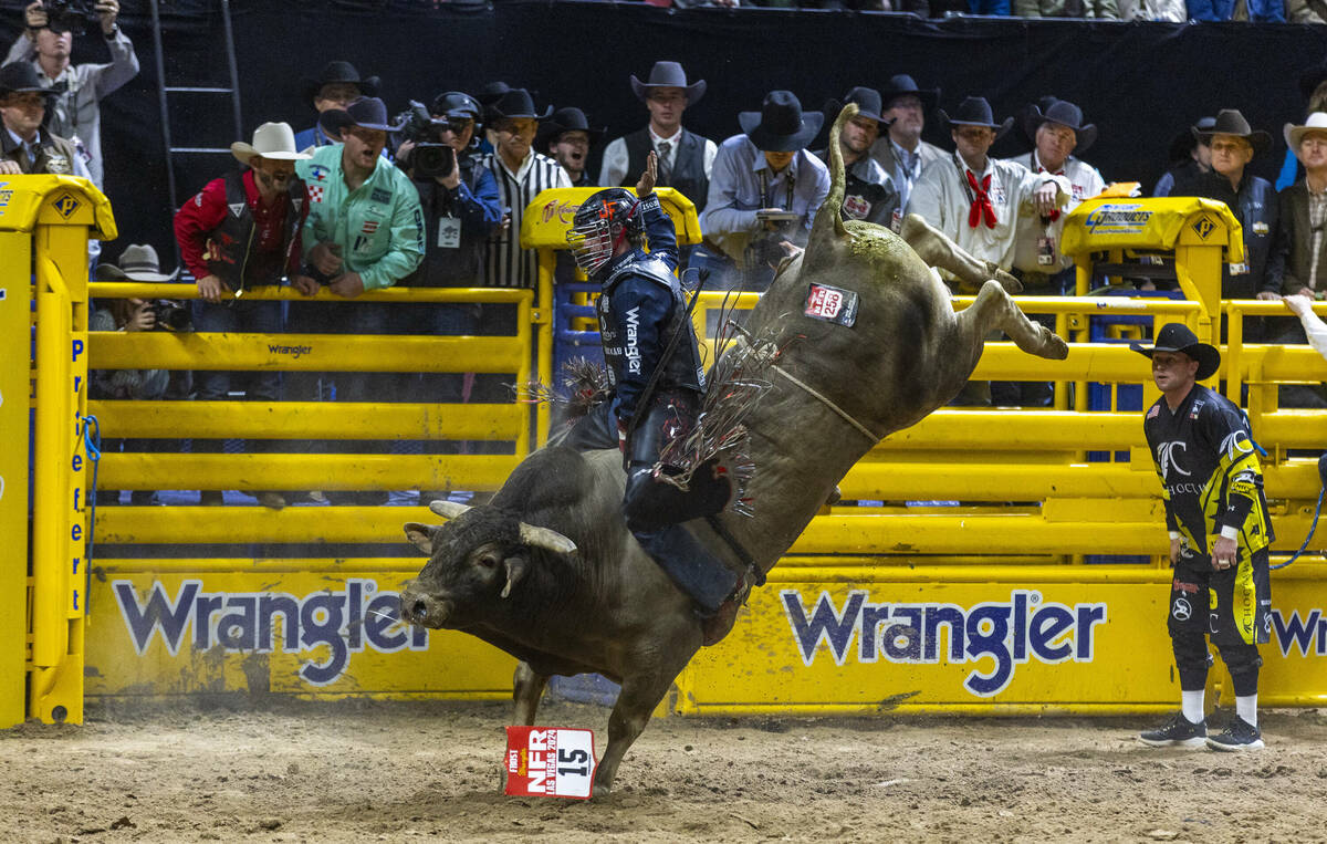 Bull Riding contestant Josh Frost rides Bill Fick Surprised to a winning score during National ...