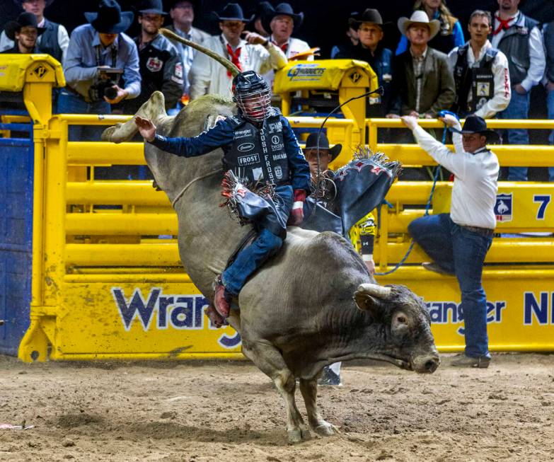 Bull Riding contestant Josh Frost rides Bill Fick Surprised to a winning score during National ...