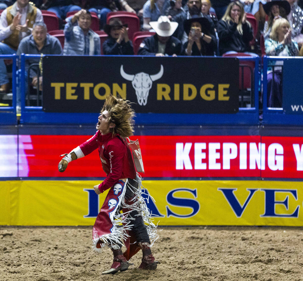 Bare Back Riding contestant Rocker Steiner celebrates after riding Tator Tot to a winning score ...