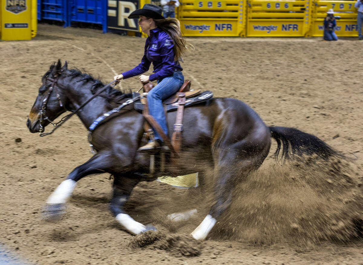 Barrel Racing contestant Kassie Mowry turns the first barrel on her way to a winning time durin ...