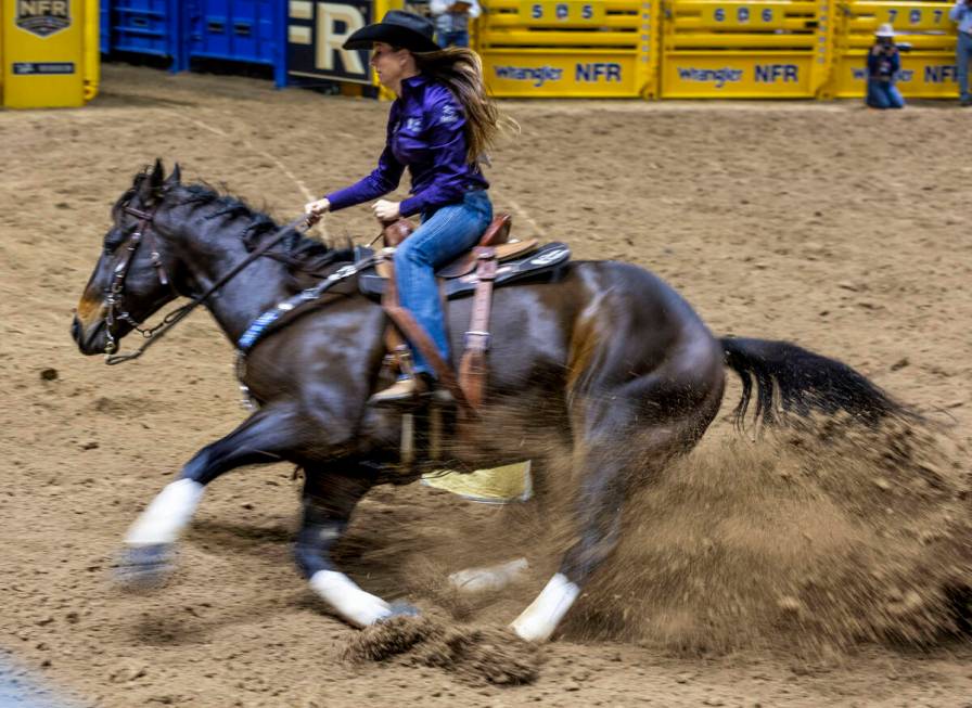 Barrel Racing contestant Kassie Mowry turns the first barrel on her way to a winning time durin ...