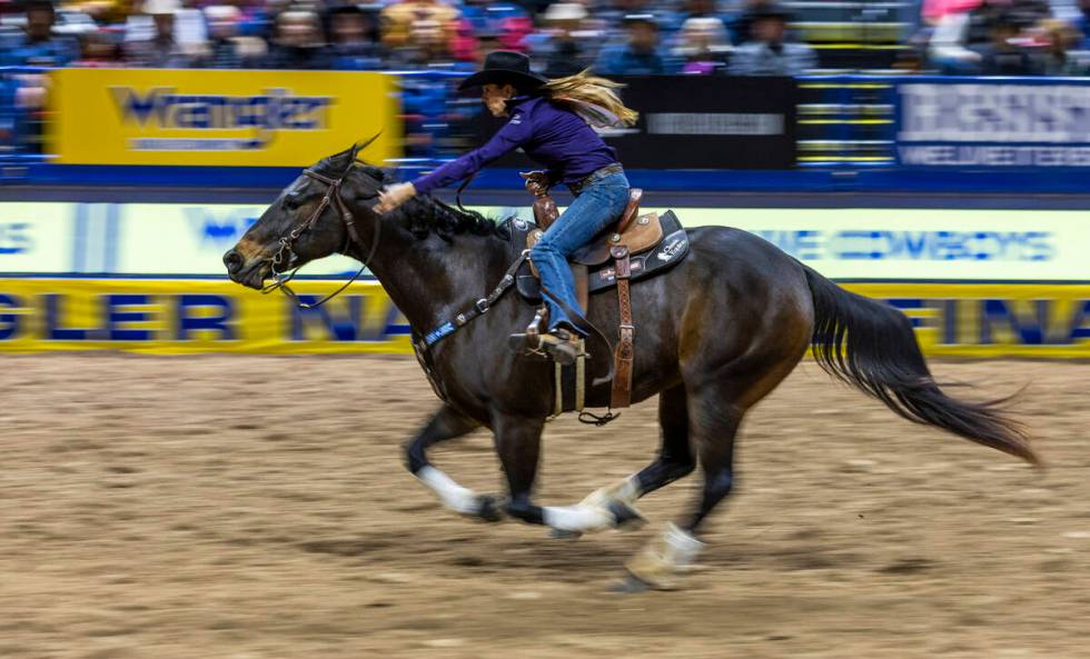 Barrel Racing contestant Kassie Mowry races for the finish line on her way to a winning time du ...