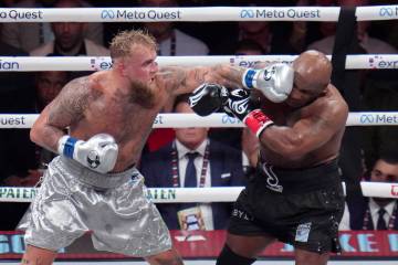 Jake Paul lands a left to Mike Tyson during their heavyweight boxing match, Friday, Nov. 15, 20 ...