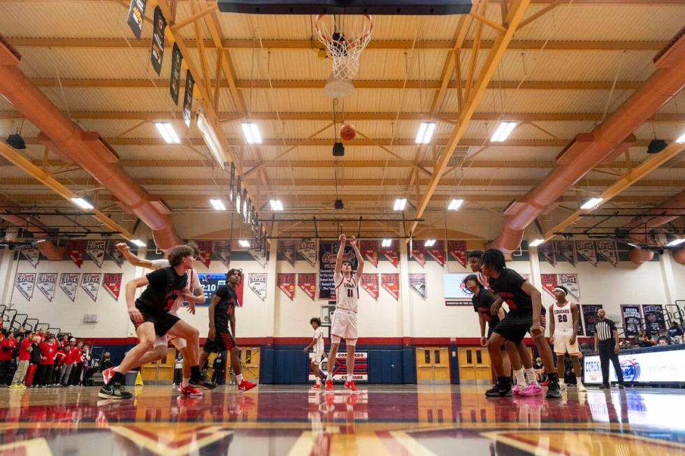 Coronado senior Mason Abittan (10) attempts a free-throw during the high school basketball game ...