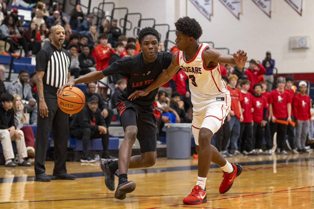 Las Vegas junior Donovan Smith, left, attempts to dribble around Coronado senior Jalen St. Clai ...