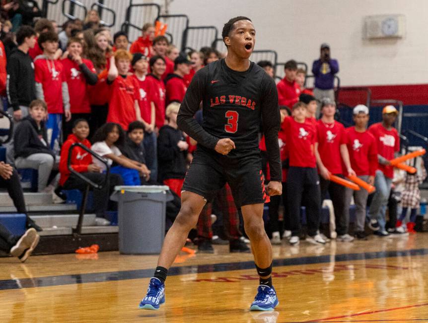 Las Vegas senior Tayshaun Jackson (3) celebrates a play during the high school basketball game ...