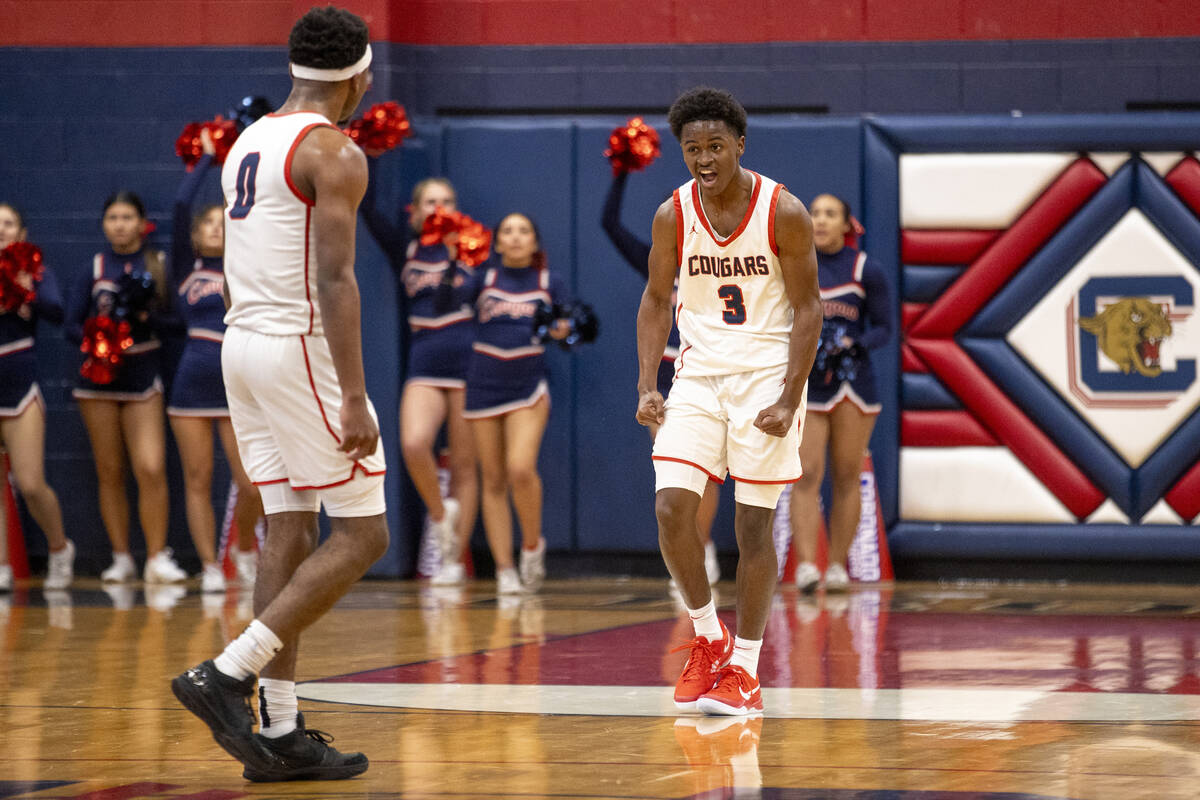 Coronado senior Jalen St. Clair (3) celebrates a play during the high school basketball game ag ...