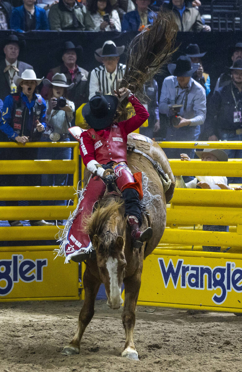 Bareback riding contestant Rocker Steiner rides Tator Tot to a winning score during National Fi ...