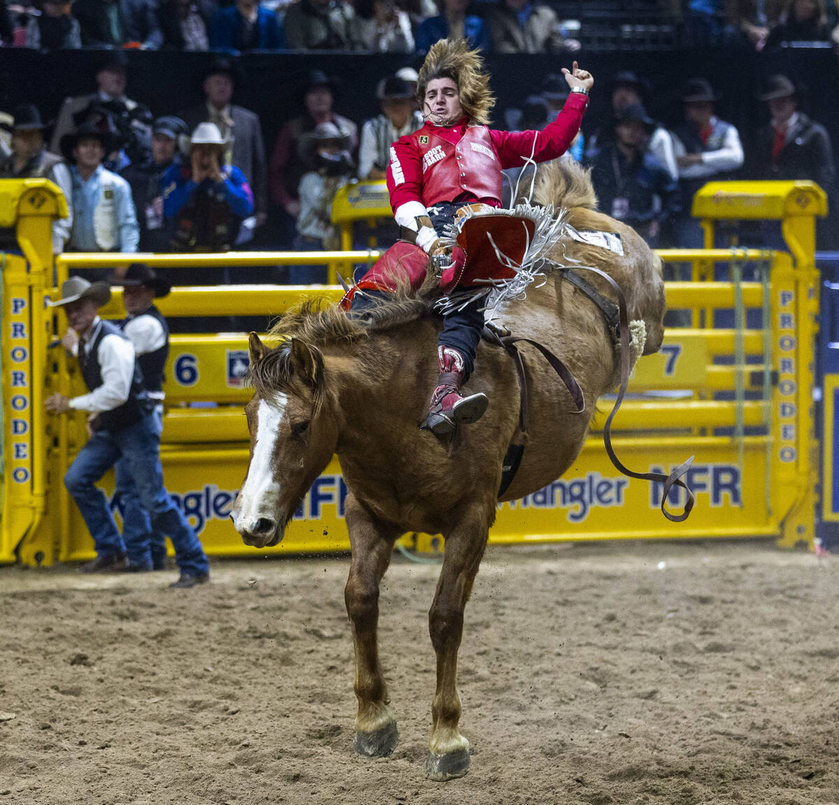 Bareback riding contestant Rocker Steiner rides Tator Tot to a winning score during National Fi ...